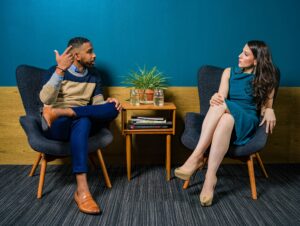 two people talking in chairs