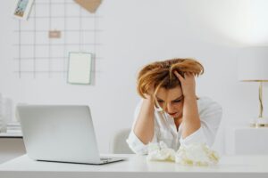 woman stressed and contemplating therapy 